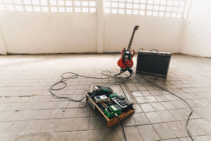 Guitar amp with a few pedals in front
