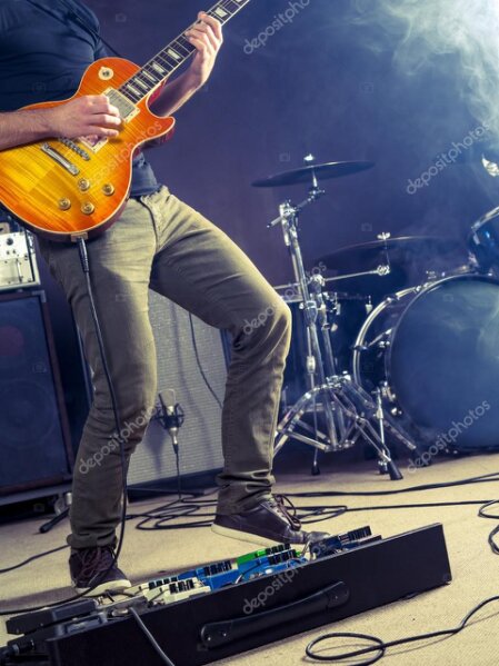 Used guitar, amp and pedals arranged together