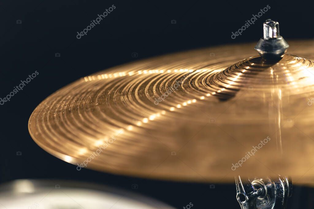 Snare drums and cymbals displayed together