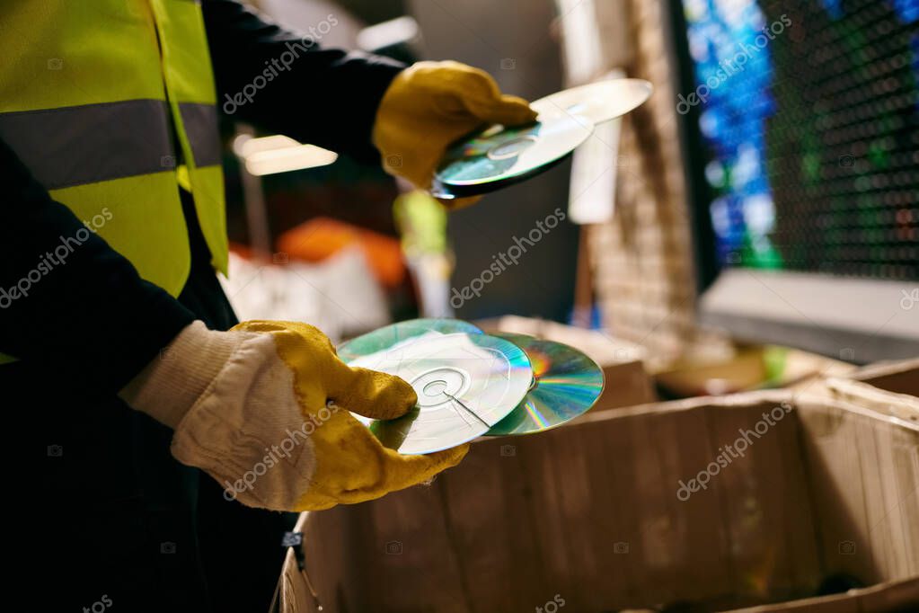 Stacks of used music CDs on a shelf